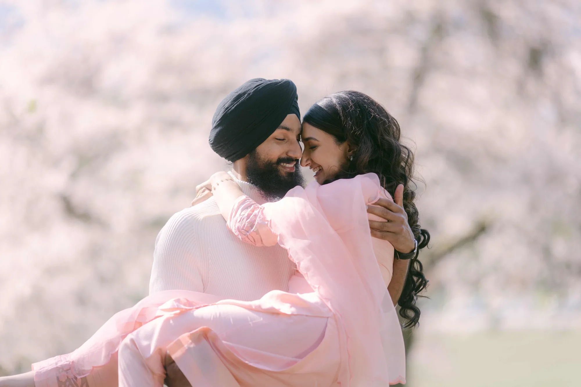 Cherry blossom spring editorial embrace in Vancouver, BC — White Daisy Weddings