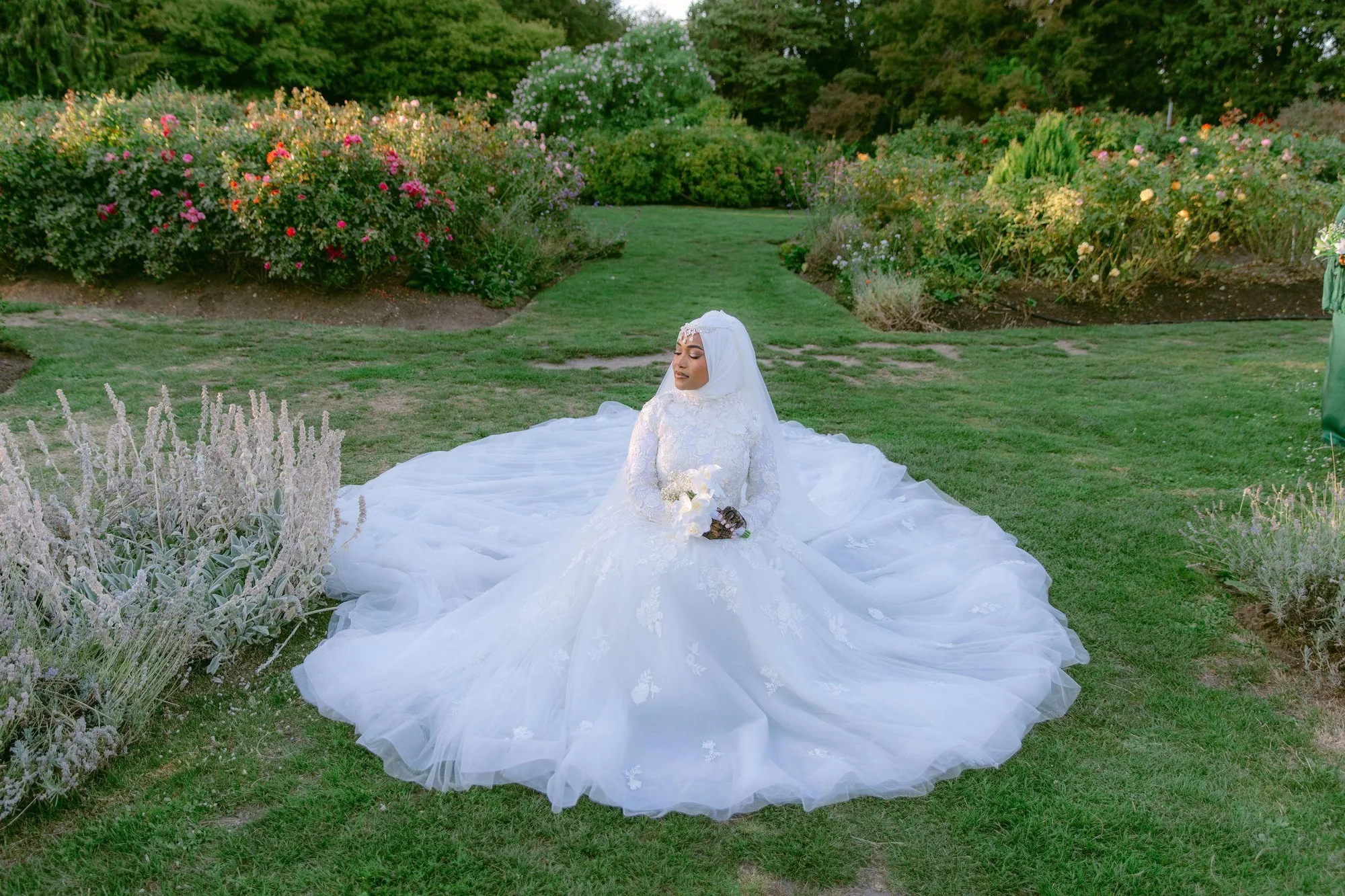 Haute couture cathedral lace wedding gown in Vancouver rose garden — White Daisy Weddings