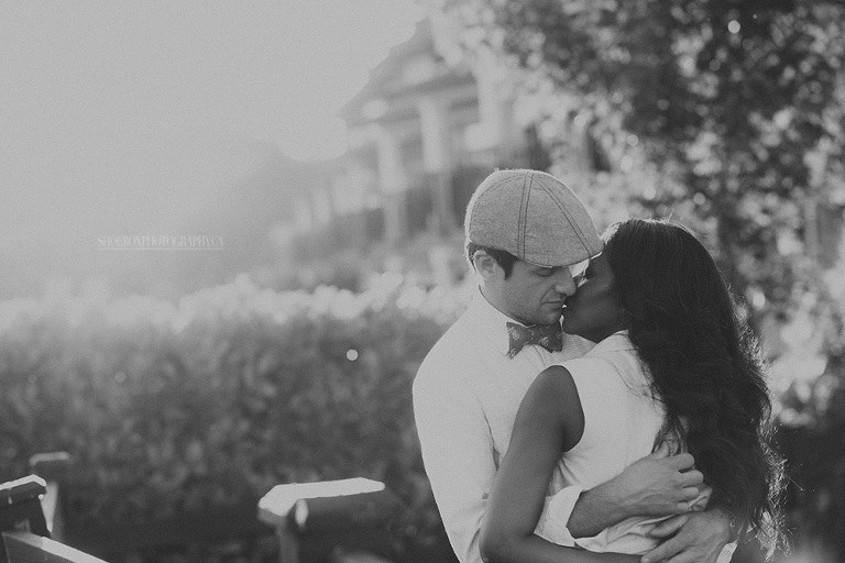 Romantic couple walking along the Fraser River boardwalk in Osprey Village South Bonson Pitt Meadows BC